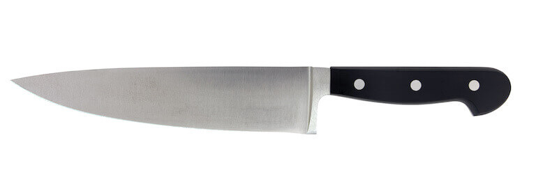 Closeup of a chef’s knife on white background.