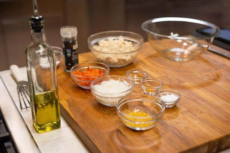 Glass bowls of ingredients gathered to make a tofu scramble.