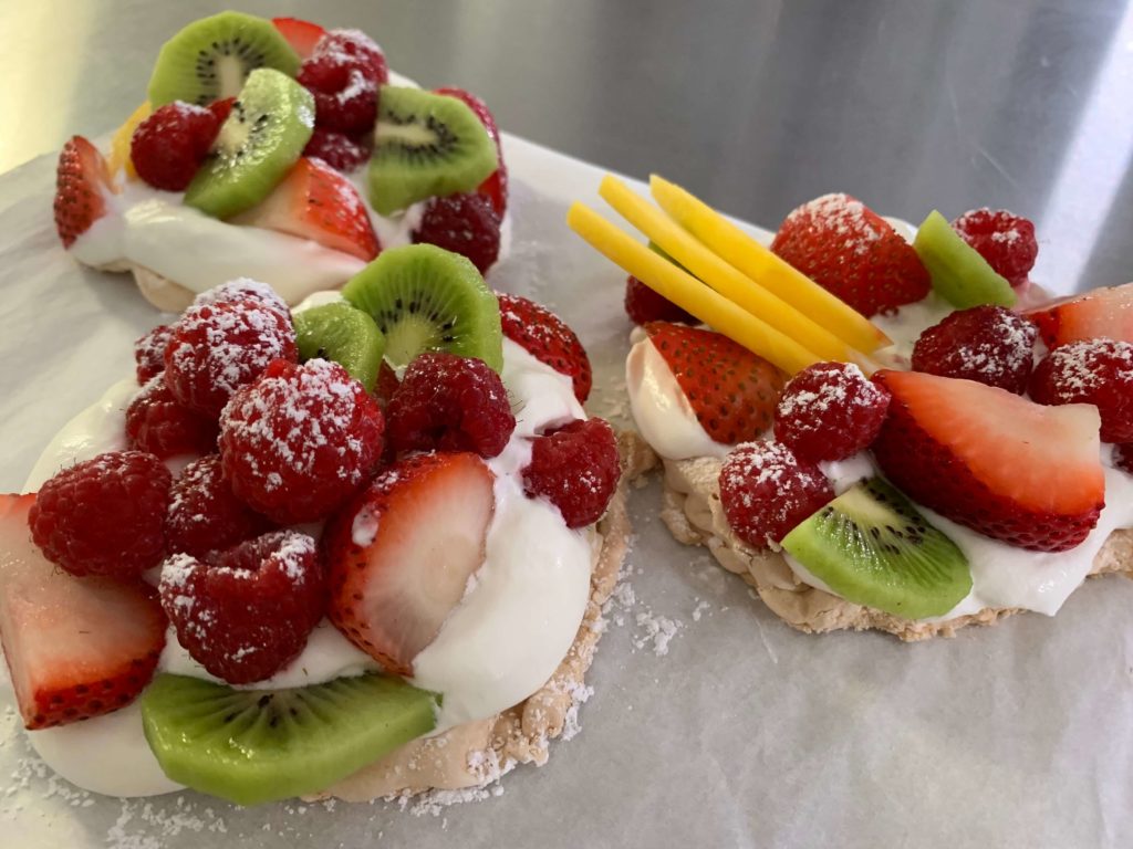 Strawberry, kiwi, mango, and cream dessert