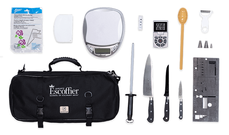 An overhead view of a culinary toolkit including knives, a scale, and other items